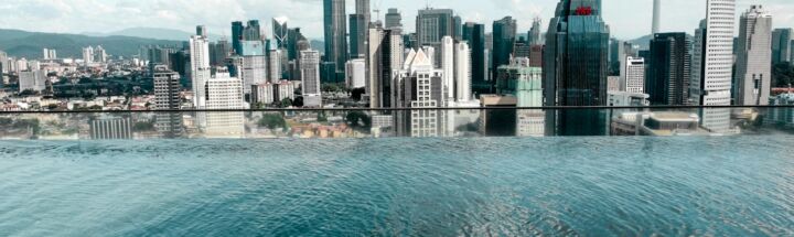 body of water near city buildings during daytime