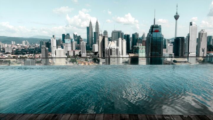 body of water near city buildings during daytime