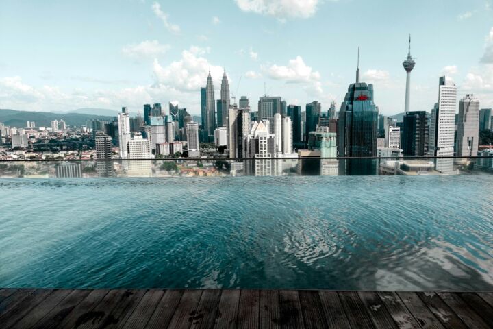 body of water near city buildings during daytime