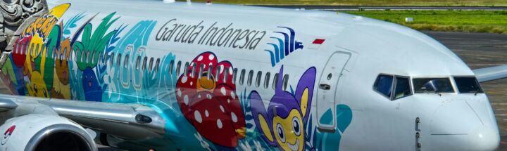 a large passenger jet sitting on top of an airport tarmac