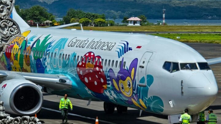 a large passenger jet sitting on top of an airport tarmac