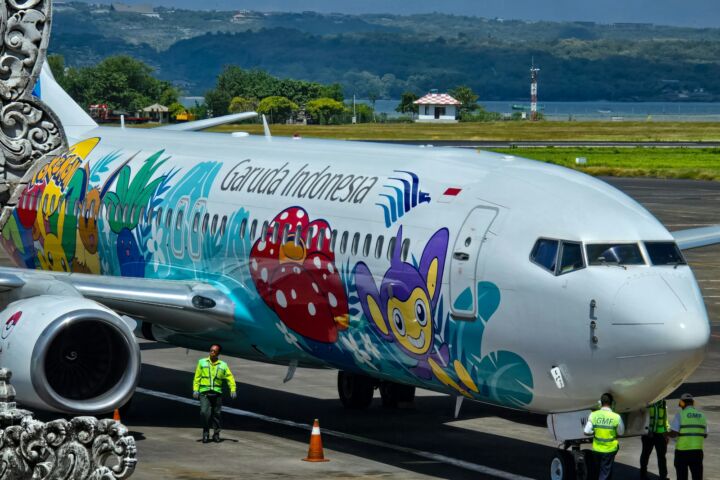 a large passenger jet sitting on top of an airport tarmac