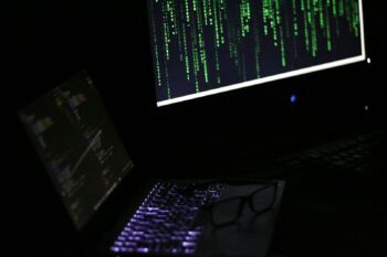 A laptop computer sitting on top of a desk