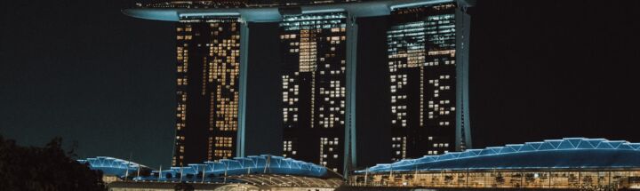 a night view of a city with tall buildings