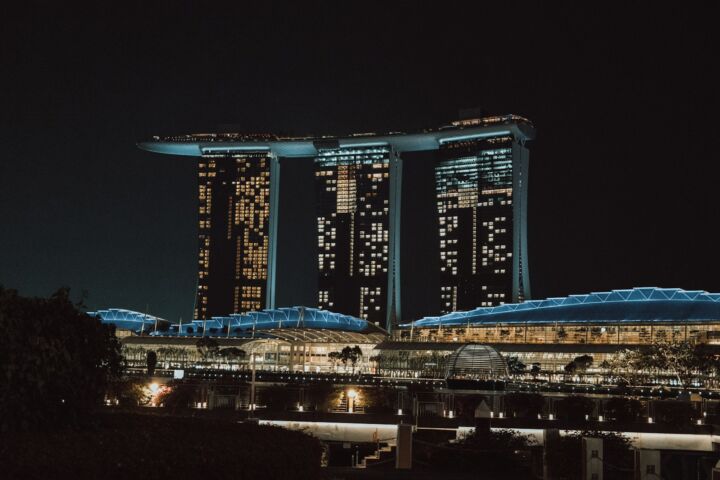 a night view of a city with tall buildings