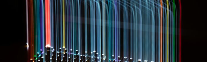 a long exposure of colored lights in the dark