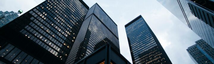 low angle photo of city high rise buildings during daytime