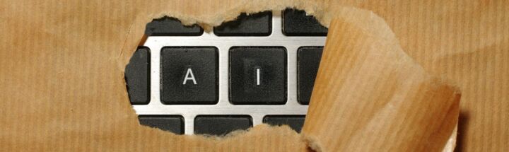 A piece of cardboard with a keyboard appearing through it