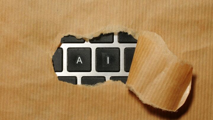 A piece of cardboard with a keyboard appearing through it