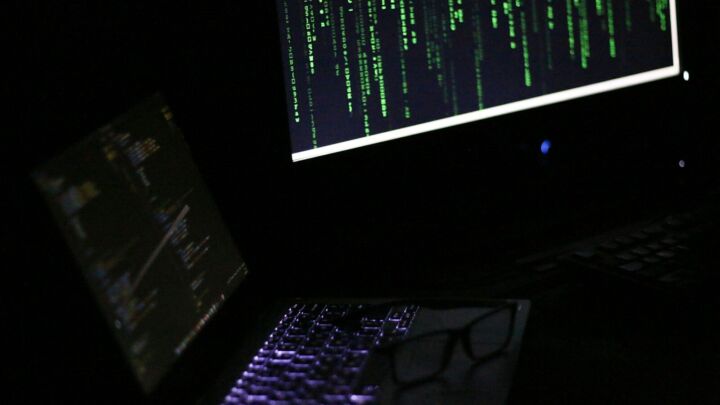 A laptop computer sitting on top of a desk