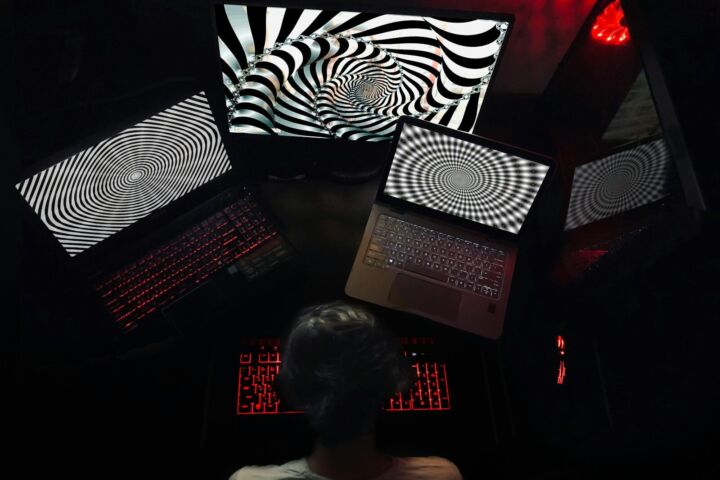 woman in white shirt sitting on chair