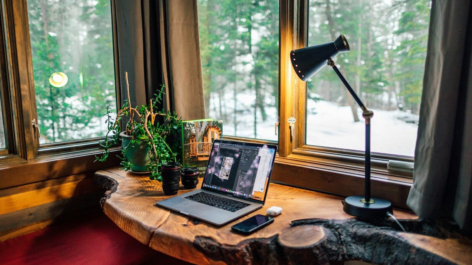 black and gray laptop computer beside black smartphone