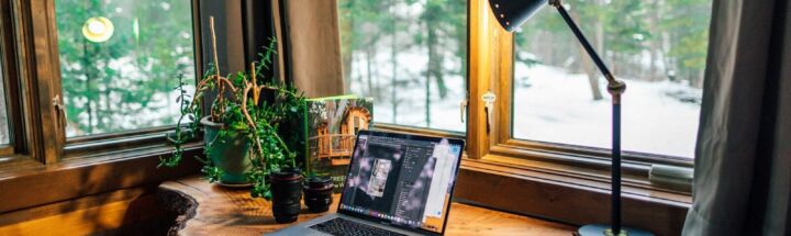 black and gray laptop computer beside black smartphone