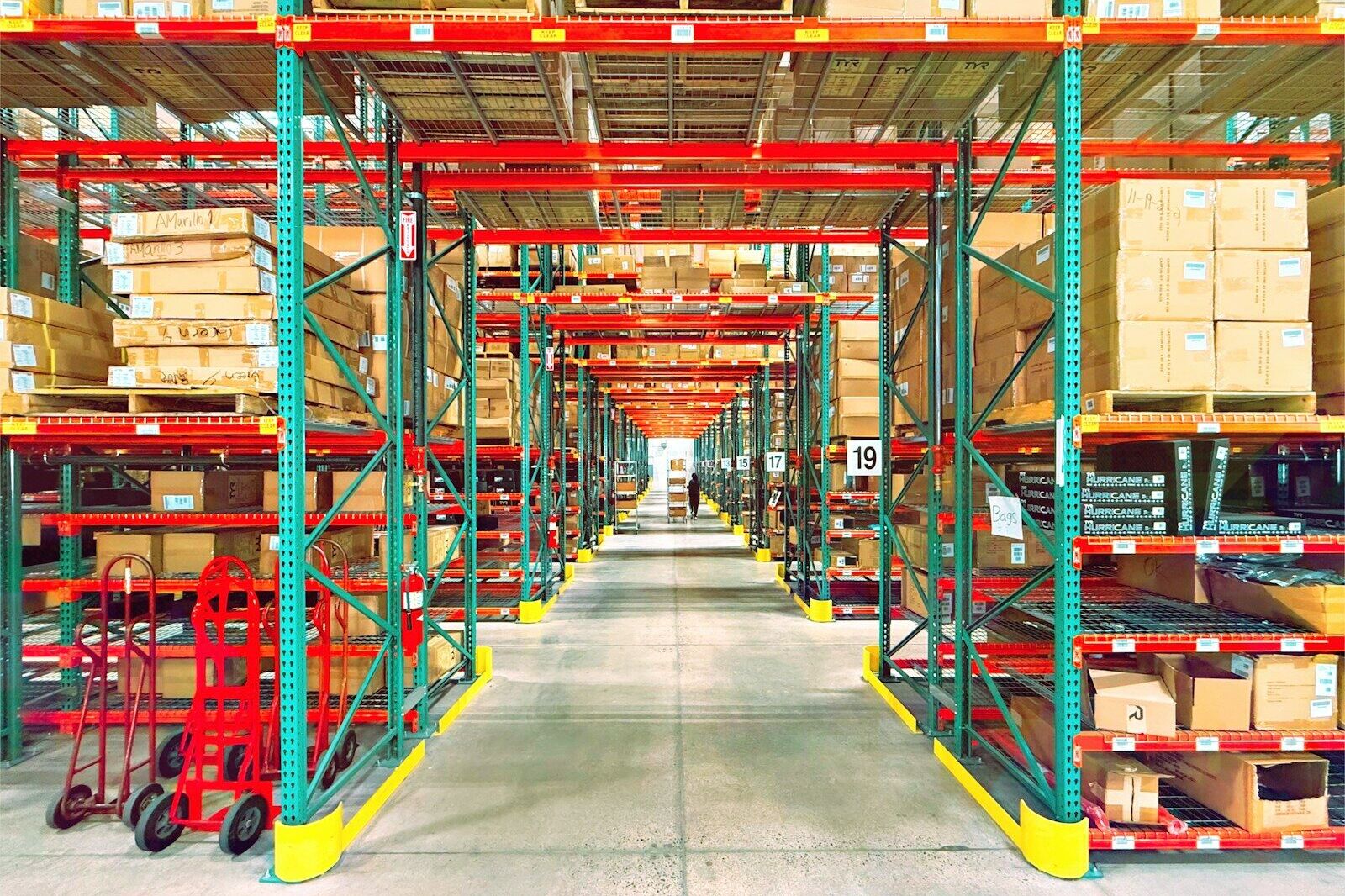 A warehouse is filled with shelves and boxes.