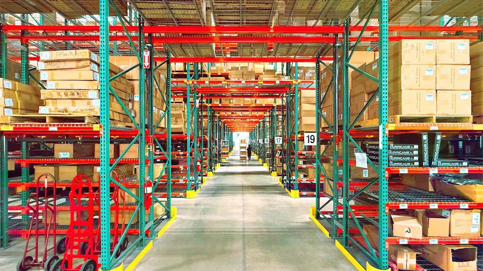 A warehouse is filled with shelves and boxes.