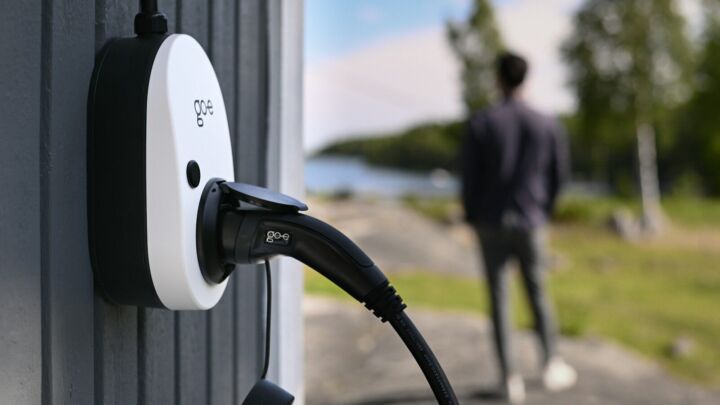 An electric vehicle charger is connected outdoors.
