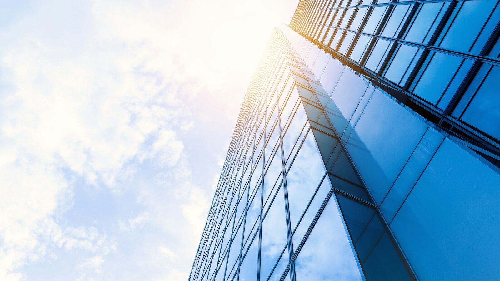 low-angle photo of curtain wall building