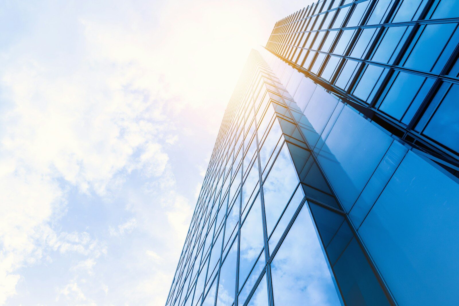 low-angle photo of curtain wall building