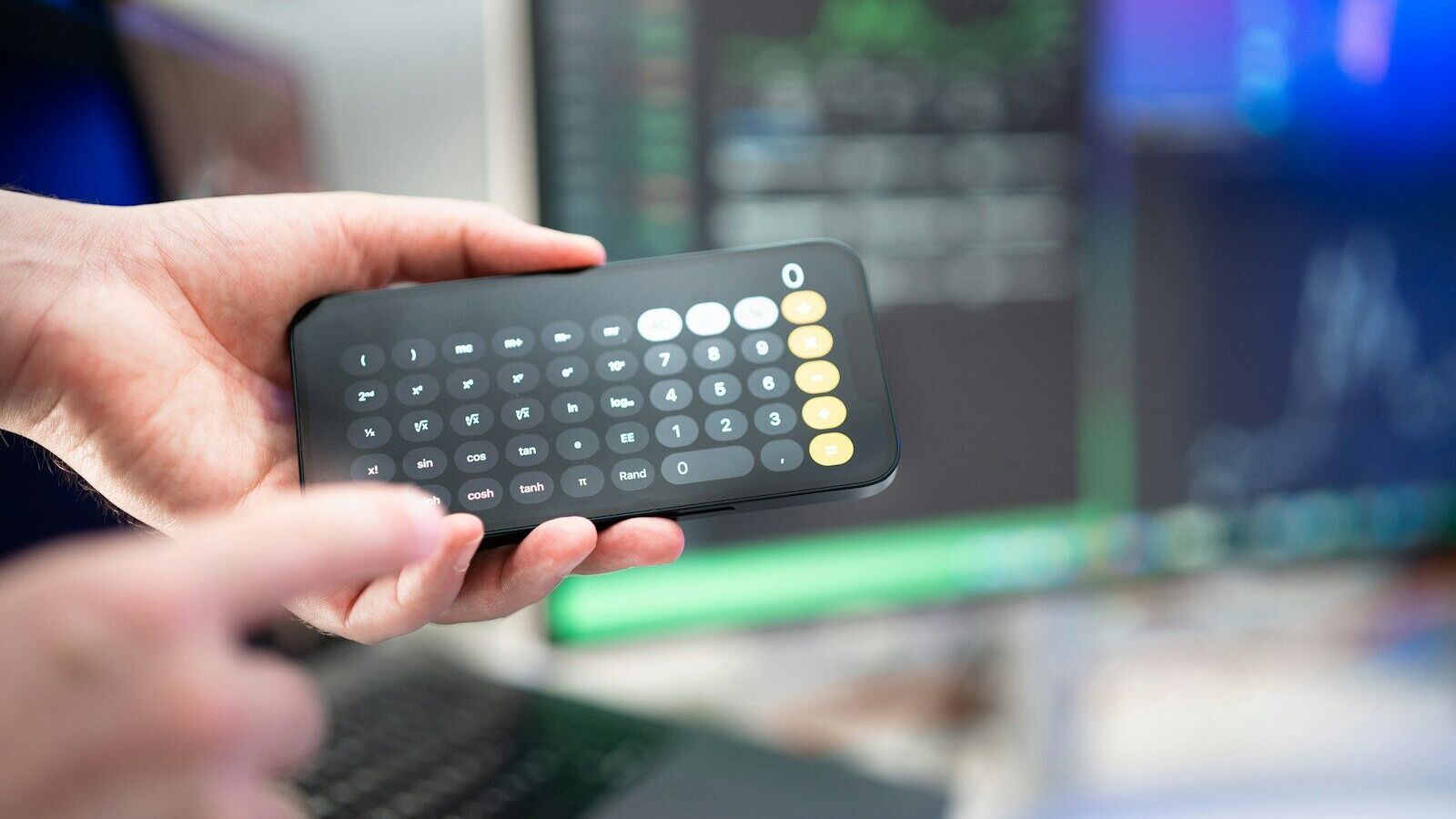 a person holding a remote control in their hand