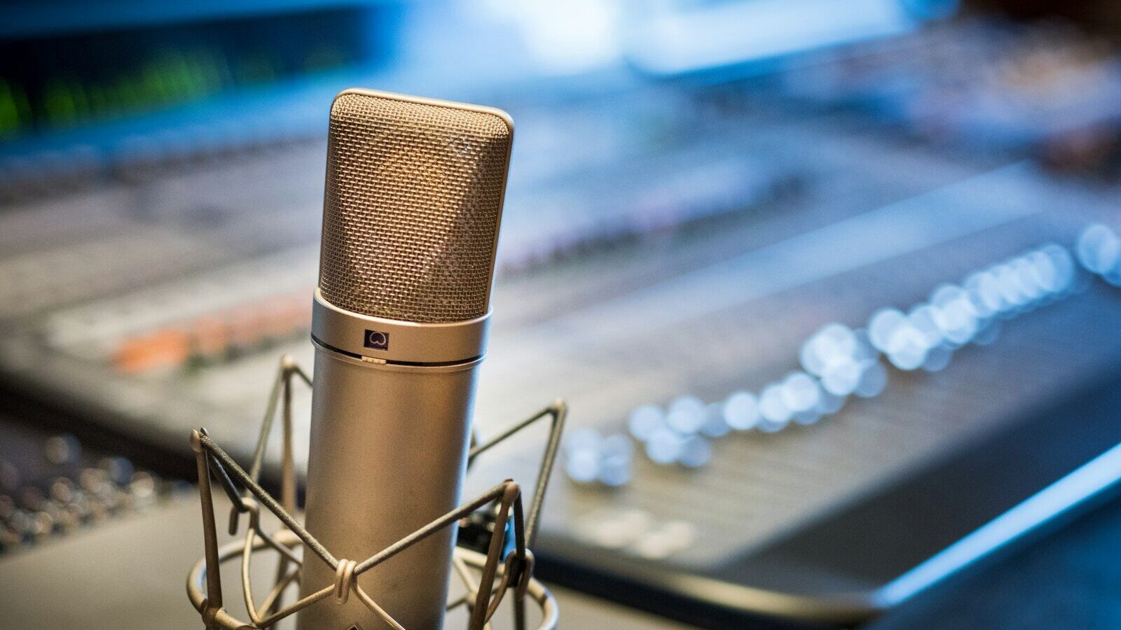 silver microphone near audio mixer