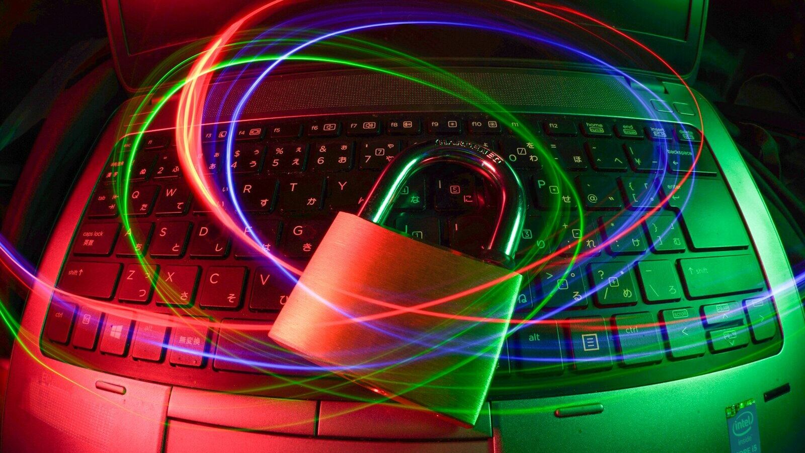 padlock on laptop with light trails
