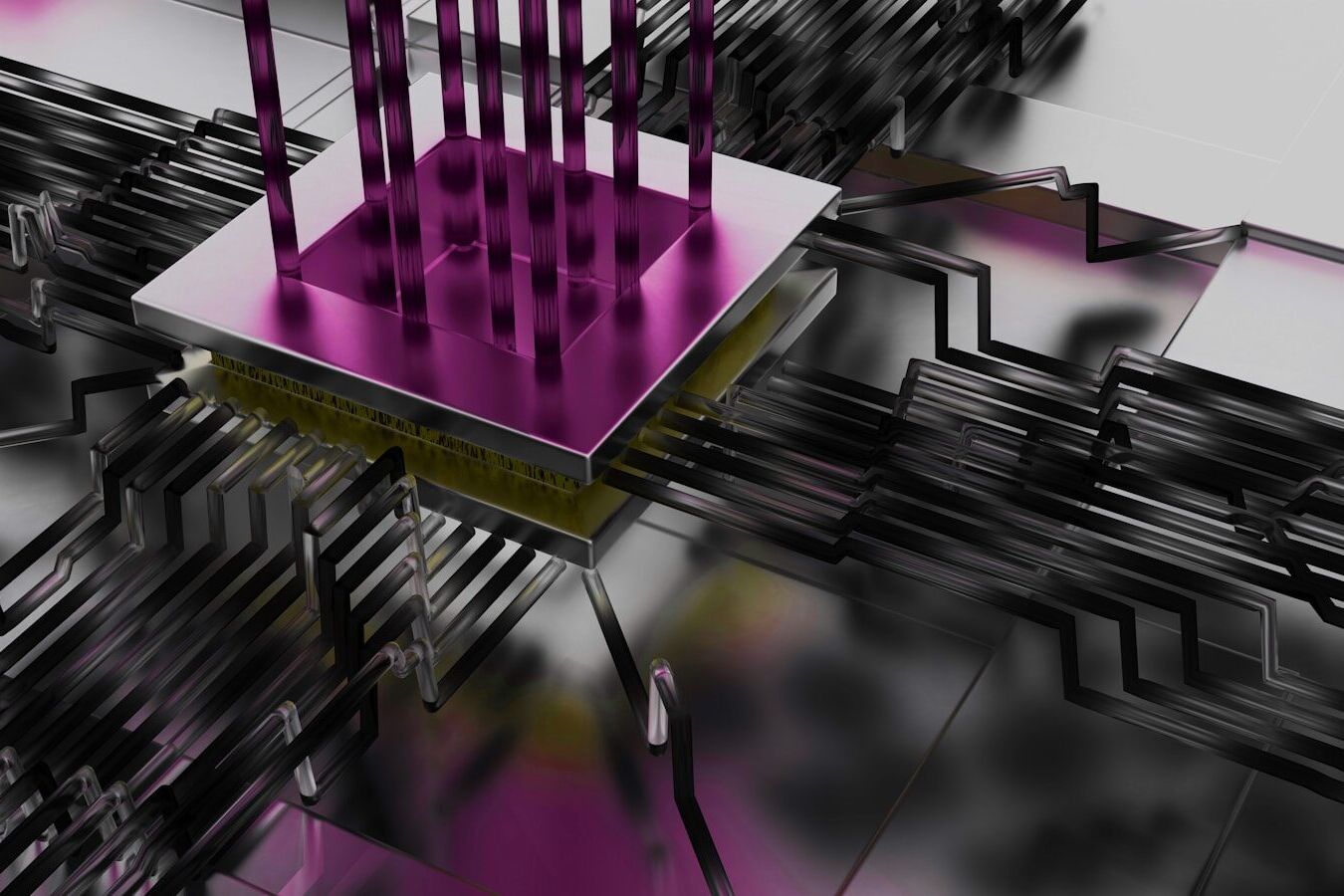 Metallic circuit board with a magenta chip and pins.