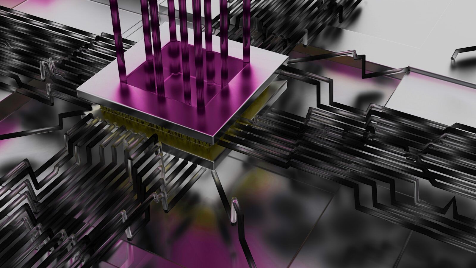 Metallic circuit board with a magenta chip and pins.