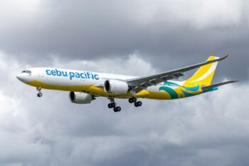 Cebu pacific airplane flying in cloudy sky