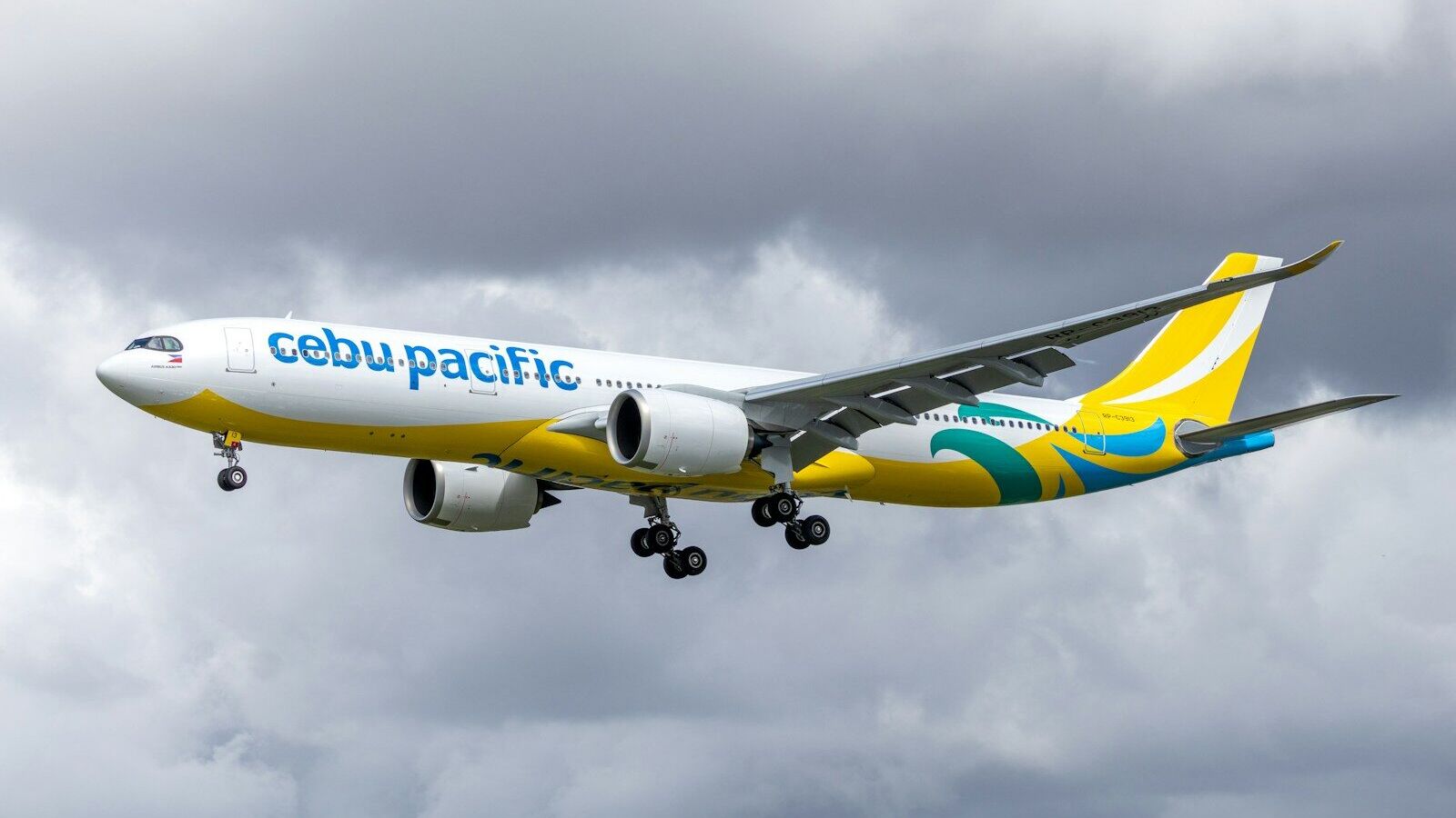 Cebu pacific airplane flying in cloudy sky