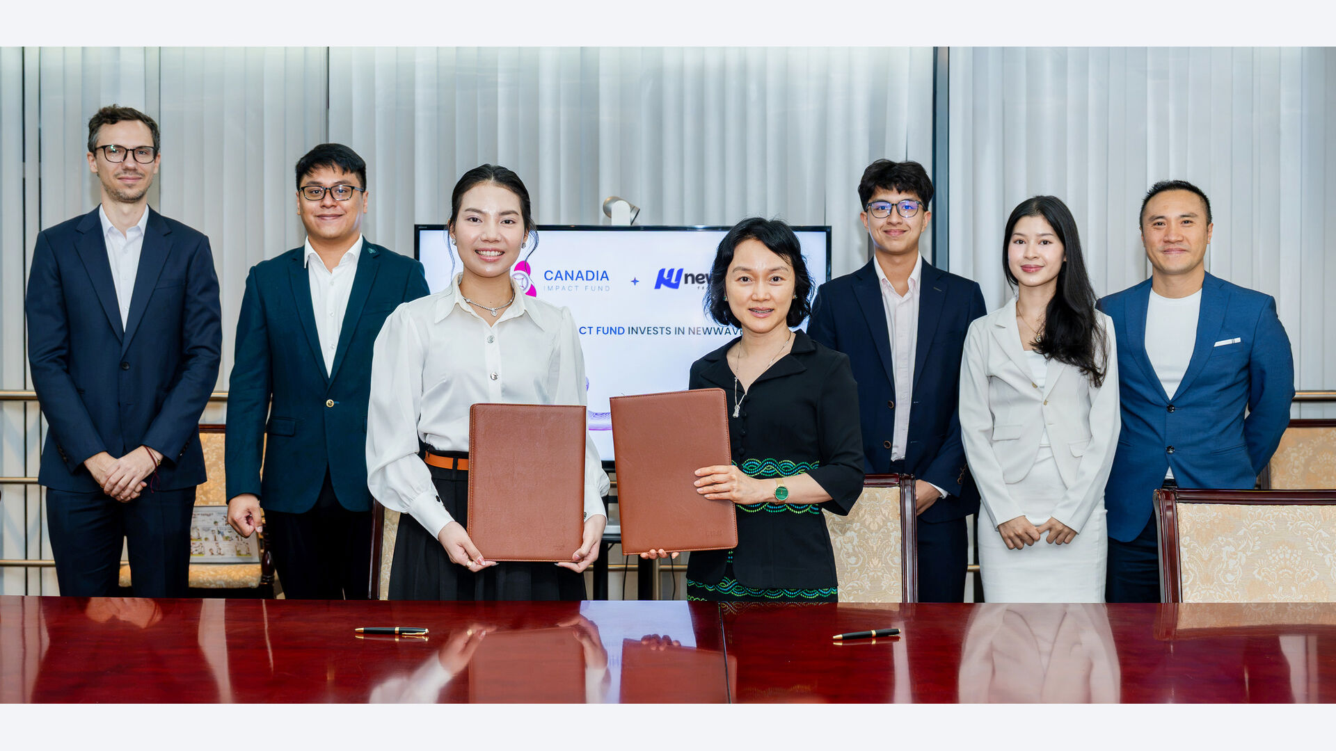 Representatives of Canadia Impact Fund and Newwave at their seed investment signing in Phnom Penh