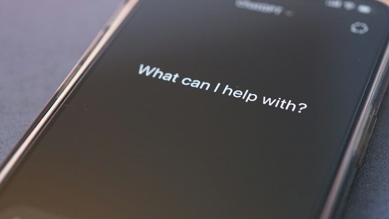 Phone screen asks: 